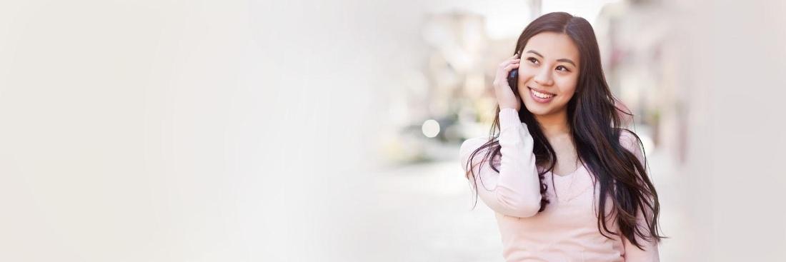 Woman using cellphone | Dentist Glendale CA