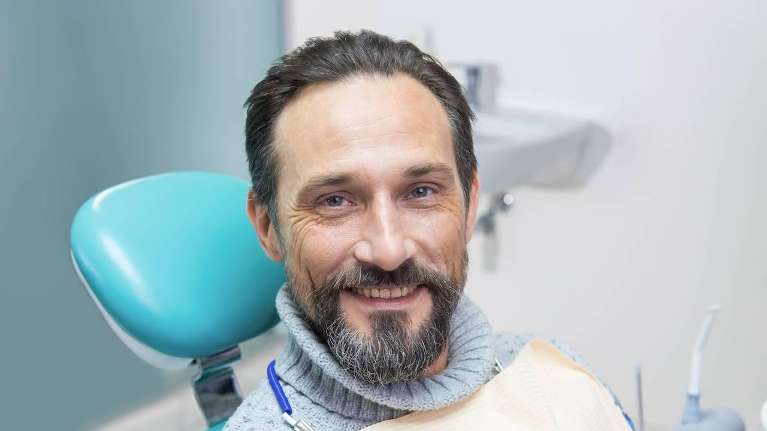 Middle aged man in dental chair, glendale ca
