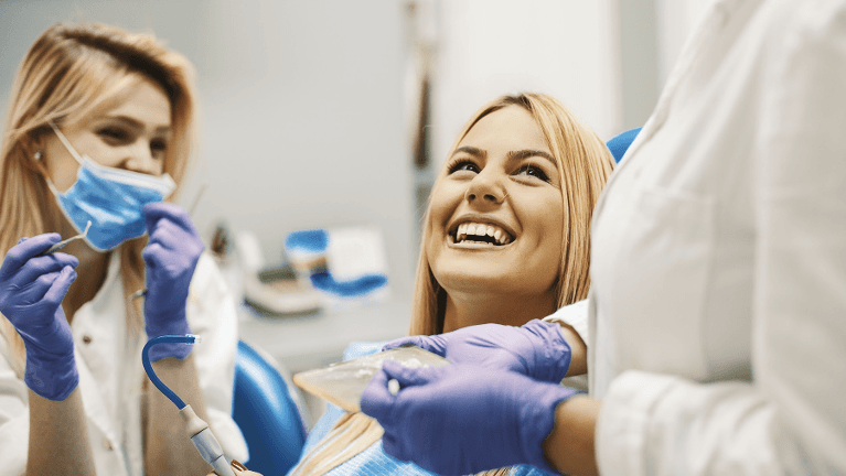 Woman smiling at dentist, glendale ca