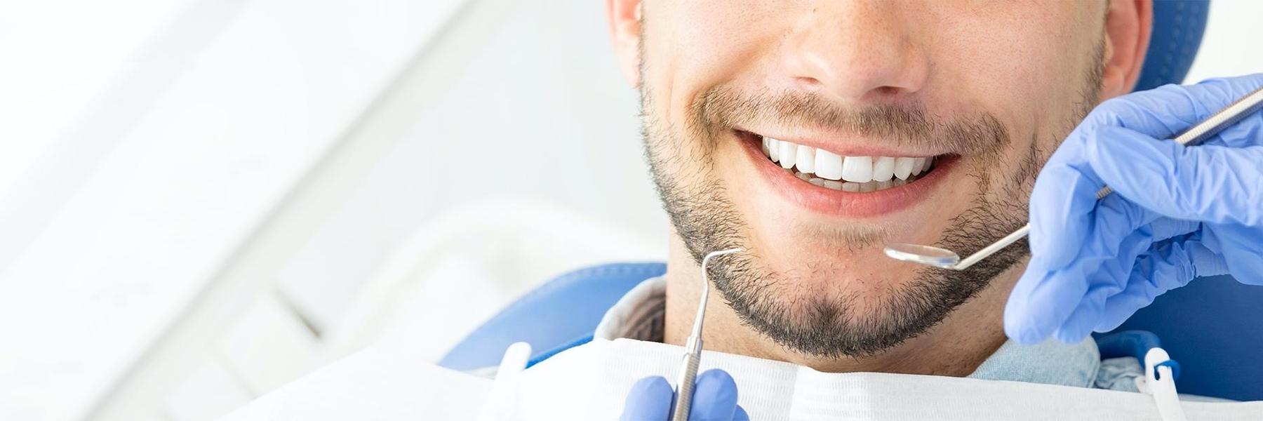 Man smiling in dental chair getting second opinion, glendale ca 