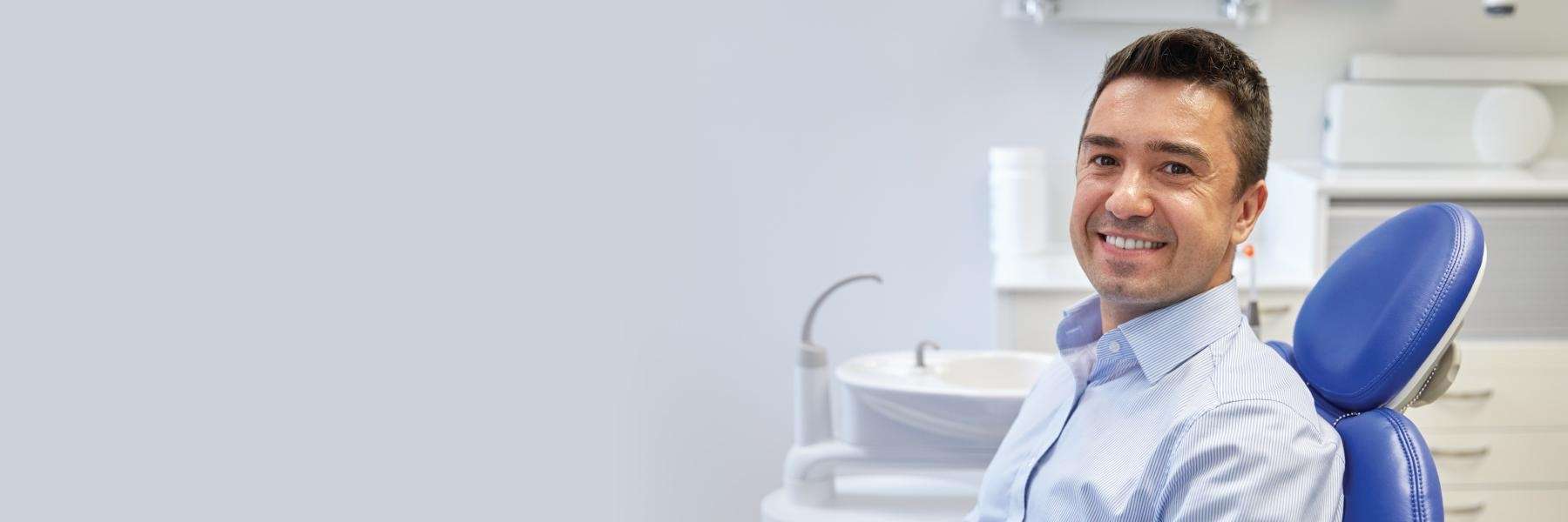 Man in dental chair smiling, glendale ca