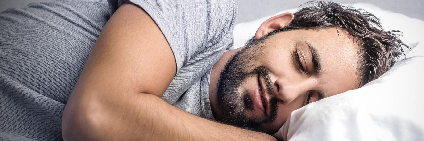 man sleeping soundly with a night guard