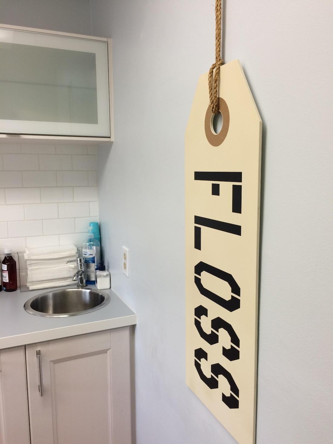 Sign with the word floss on it | Dentist Glendale CA